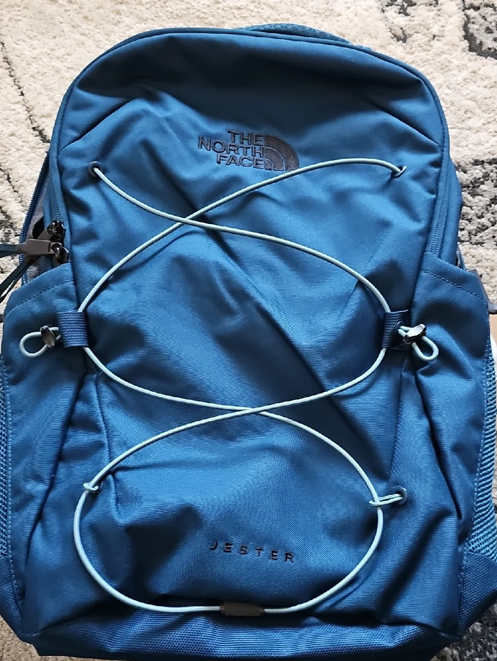 The North Face Jester Backpack in Blue with Light Blue Bungee